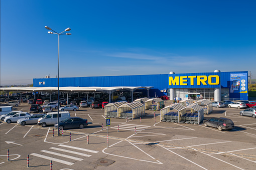 Chisinau, Moldova - October, 2020: Metro retail store, large shopping mall of household and food goods with parking, aerial view, copyspace