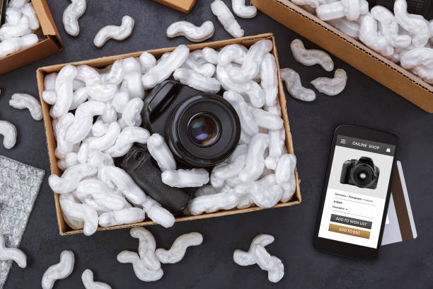 istock Online shopping of digital camera concept on dark background 1282931536