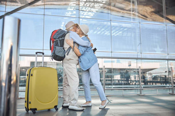 istock Man with a cellphone hugging a joyous woman 1282932695