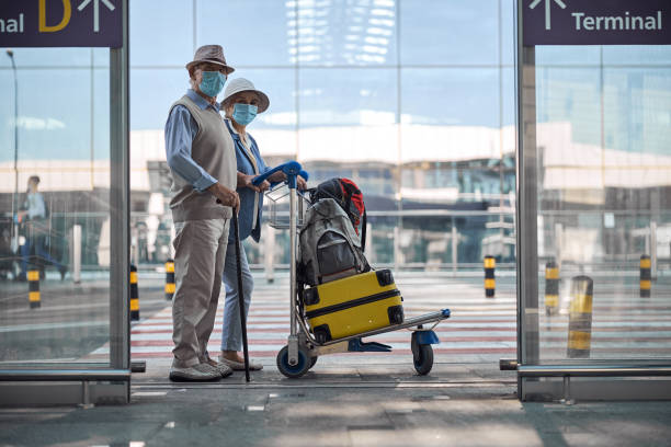 istock Two senior people at the airport terminal 1282932722