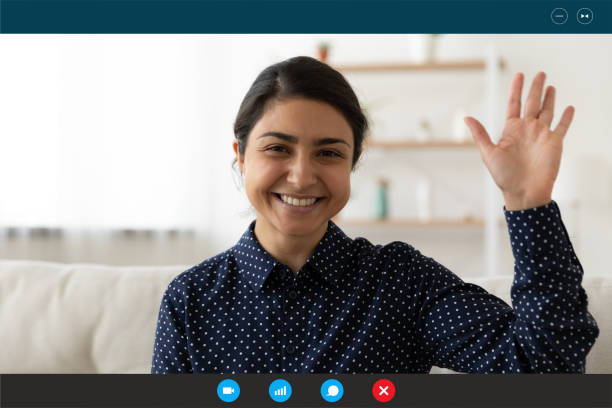 istock Smiling Indian woman wave talking on video call 1282935500