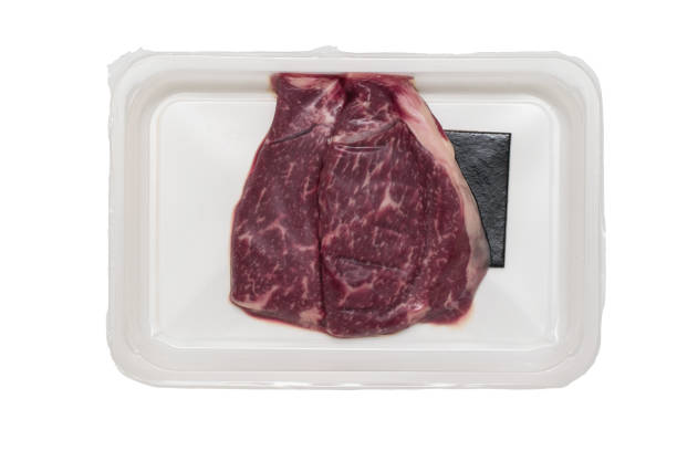 istock Vacuum-Packed beef steaks isolated on a white background. 1282941732