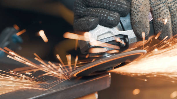istock Saws metal with a circular saw, many sparks. The working process. Macro view 1282942287
