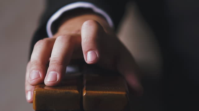 businessman hand taps armchair armrest by finger closeup