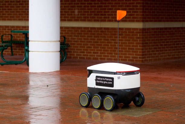 food delivery robot in the rain, george mason university - george mason imagens e fotografias de stock