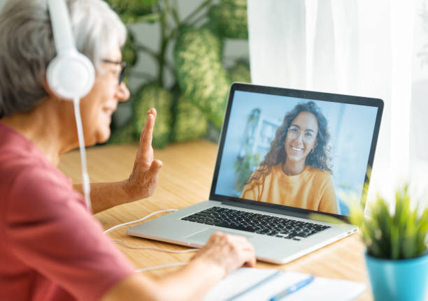 istock Senior woman is using laptop for conversation with daughter 1282950930
