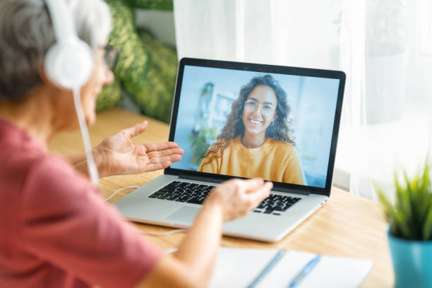 istock Senior woman is using laptop for conversation with daughter 1282950936