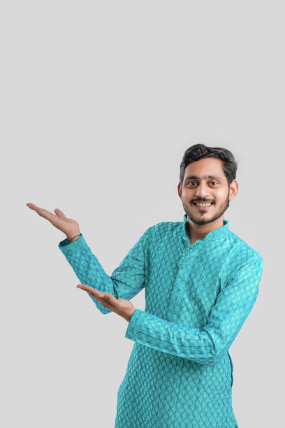 istock Indian man in ethnic wear and Showing Direction 1282951632