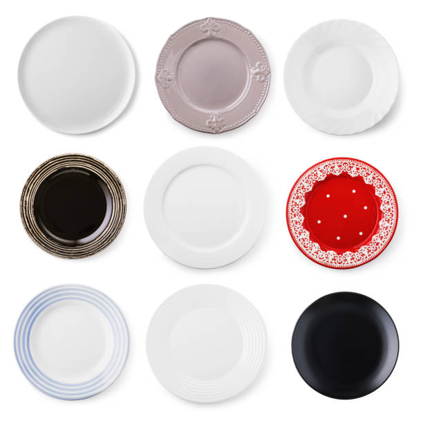 istock Set of empty multi-colored ceramic plates isolated on a white background, top view 1282955687