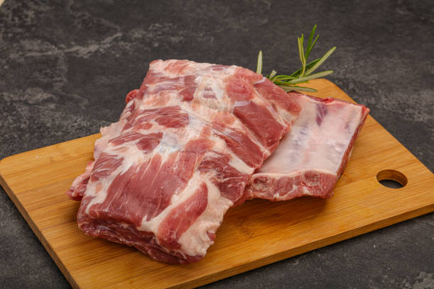 istock Raw pork ribs served rosemary 1282956843