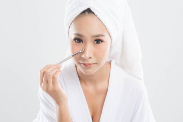 istock Woman in bathrobe with towel with towel on head. 1282962218