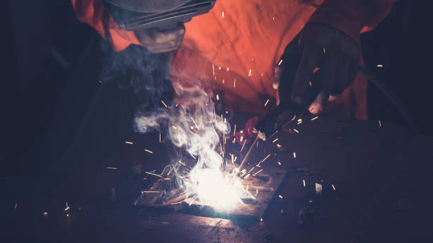 istock Metal welder working with arc welding machine 1282962676