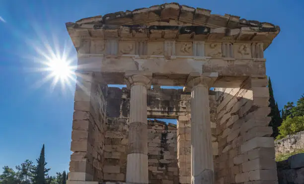 Photo of Treasury of Athens, Archeological site of Delphi, Greece. Built to commemorate their victory at the Battle of Marathon.