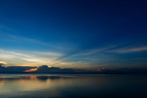 Seascape after sunset sky at the lake in blue hour.