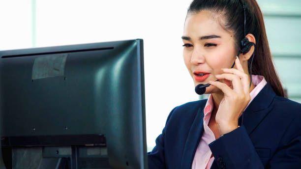istock Business people wearing headset working in office 1282964023
