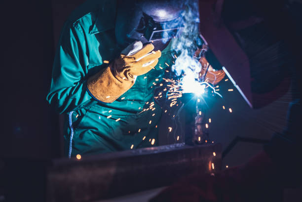 istock Metal welding steel works using electric arc welding machine 1282966791
