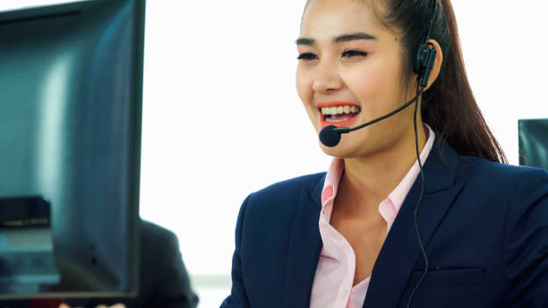istock Business people wearing headset working in office 1282966876