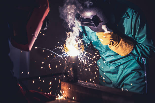 istock Metal welding steel works using electric arc welding machine 1282968109