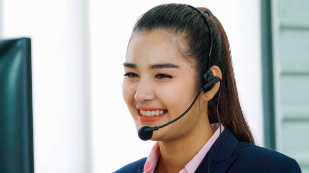 istock Business people wearing headset working in office 1282969110