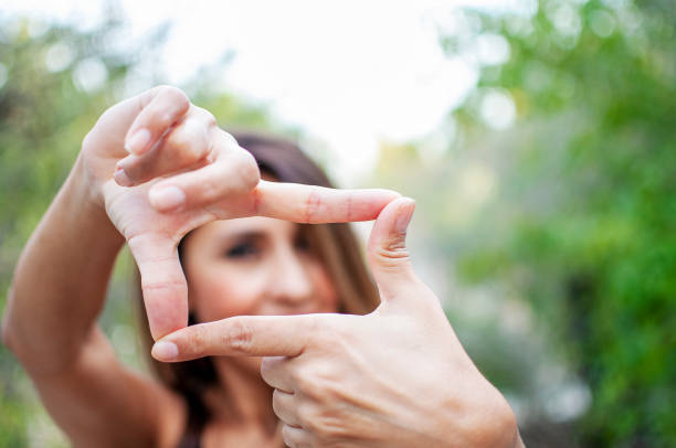 istock Photo frame hands with woman 1282970446