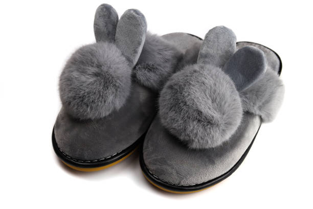istock Slippers with fluffy ears, comfortable women's home shoes isolated on white 1282972013