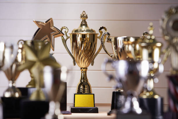 istock selective focus on one trophy with other trophies as background 1282973865