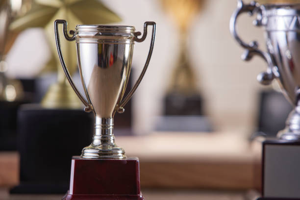 istock selective focus on one trophy with other trophies as background 1282973876