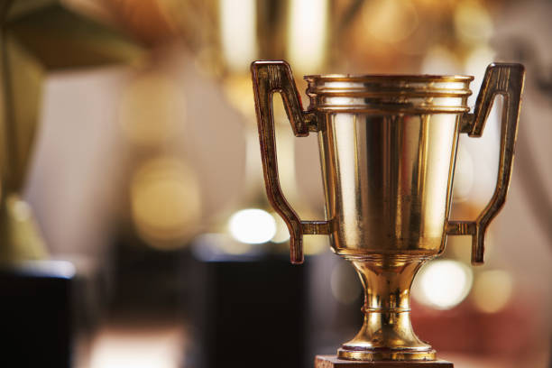 istock selective focus on one trophy with other trophies as background 1282974014