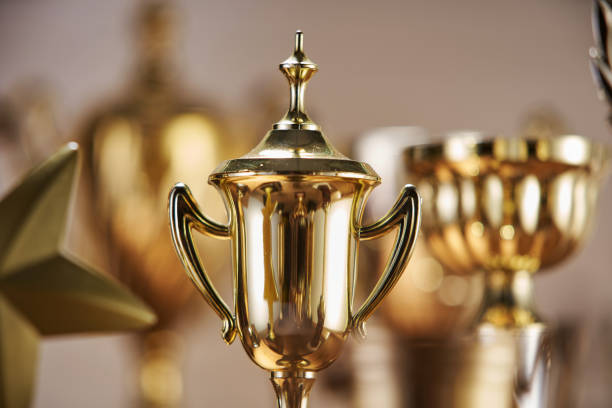 istock selective focus on one trophy with other trophies as background 1282974041