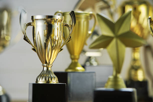 istock selective focus on one trophy with other trophies as background 1282974101