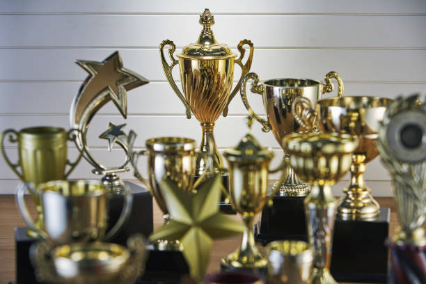istock selective focus on one trophy with other trophies as background 1282974102
