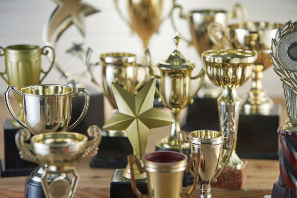 istock selective focus on one trophy with other trophies as background 1282974117