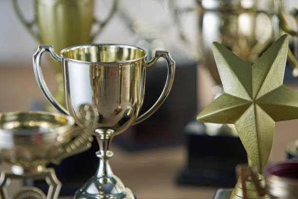 istock selective focus on one trophy with other trophies as background 1282974355