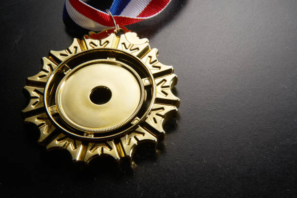 istock golden medal on green background 1282974412