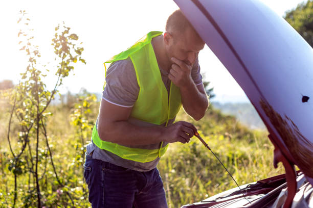 istock Checking the engine oil level on his car. 1282974529