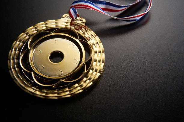 istock golden medal on green background 1282974550