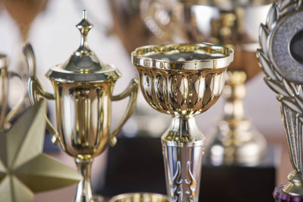 istock selective focus on one trophy with other trophies as background 1282974586