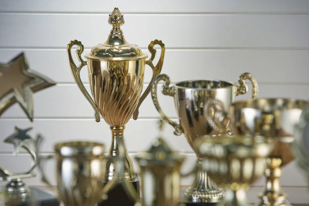 istock selective focus on one trophy with other trophies as background 1282974596