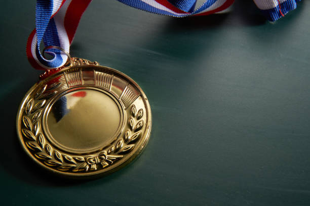 istock golden medal on green background 1282974640