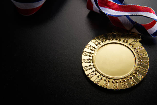 istock golden medal on green background 1282974657