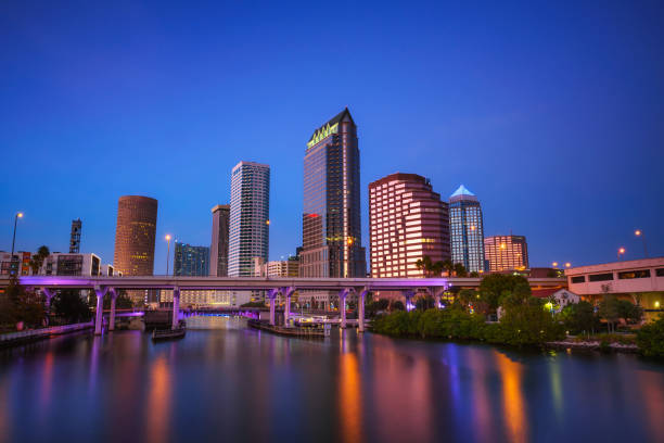 Tampa skyline after sunset with Hillsborough river in the foreground stock photo