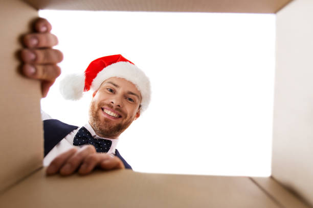 istock happy young man looking into open christmas gift 1282975613