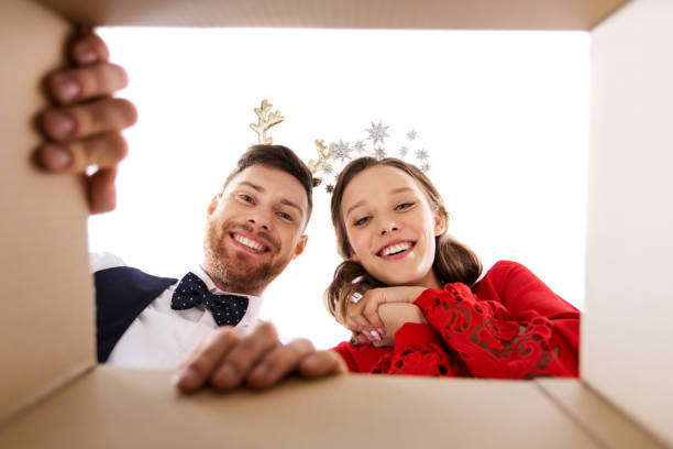 istock happy couple opening christmas gift box 1282975873