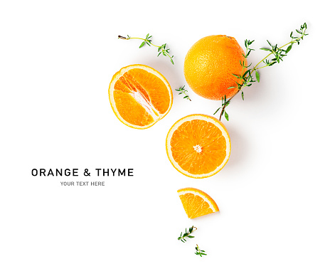 Orange citrus fruit and thyme creative layout isolated on white background. Healthy eating and food concept. Fruits and herbs composition. Flat lay, top view