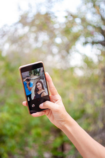 istock Woman using mobile phone outdoors 1282977766
