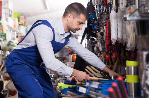 istock male is standing with new hammer 1282980395