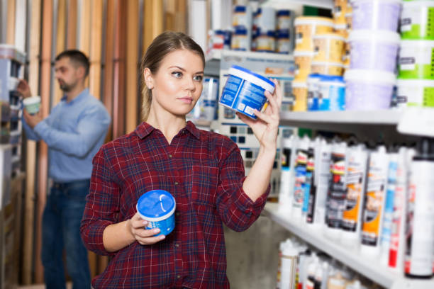 istock Woman is choosing with paint for repair 1282981012