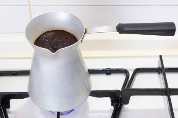istock Brewing coffee in a turk on the stove 1282981118