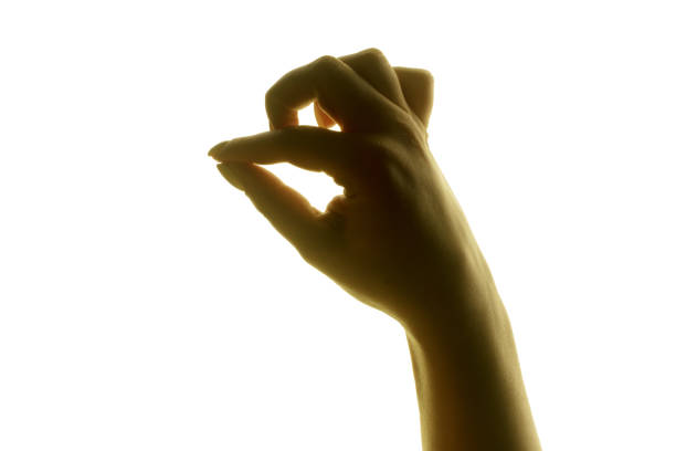 istock silhouette of a woman's hand on a bright white background. 1282981289
