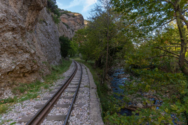 The DiakoptoâKalavryta railway, a historic rack railway runnning 22 km from Diakopto through the Vouraikos Gorge to the old Mega Spilaion Monastery, Zachlorou and up to Kalavryta. Peloponnese, Greece el ferrocarril diakopto-kalavryta, un histórico ferrocarril de cremallera que se encuentra a 22 km de diakopto a través de la garganta de vouraikos hasta el antiguo monasterio mega spilaion, zachlorou y hasta kalavryta. peloponeso, grecia